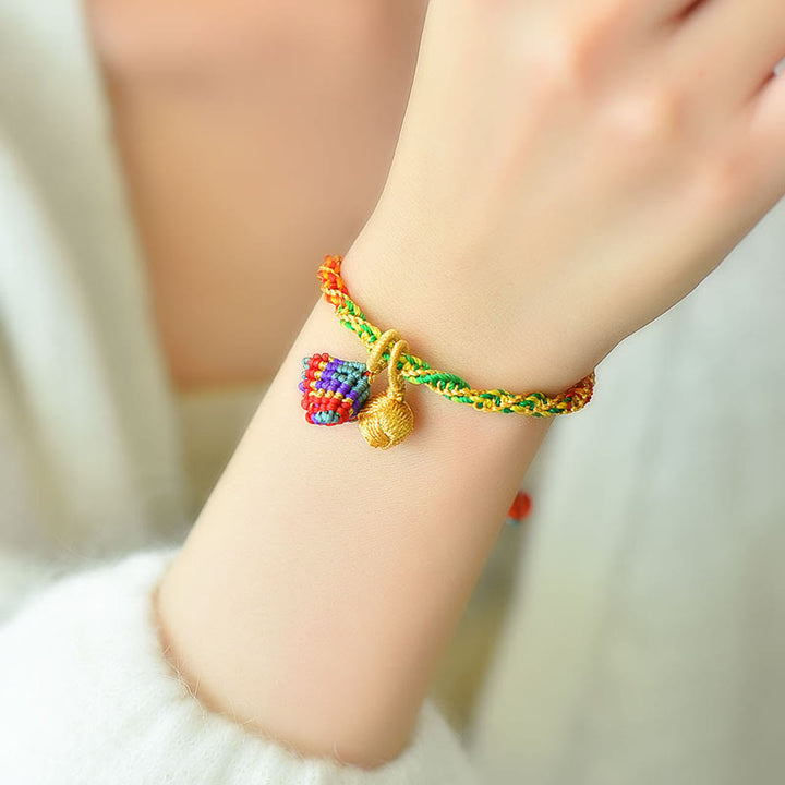 Pulsera con dijes Zongzi hecha a mano con cuerda colorida y Buddha Stones