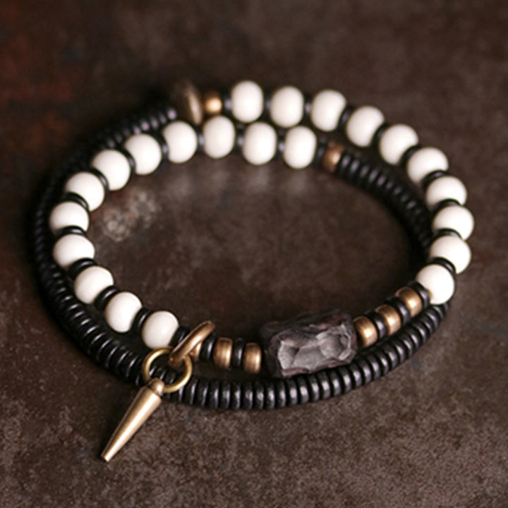 Pulsera de pareja con Buddha Stones, cuentas de hueso, madera de ébano y cobre.