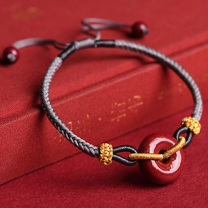 Pulsera trenzada artesanal de cinabrio con patrón de hebilla de paz de Buddha Stones