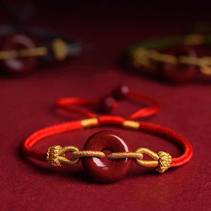 Pulsera trenzada artesanal de cinabrio con patrón de hebilla de paz de Buddha Stones