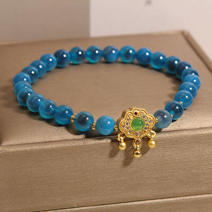 Pulsera curativa con dije de cerradura china de ágata azul caramelo con Buddha Stones
