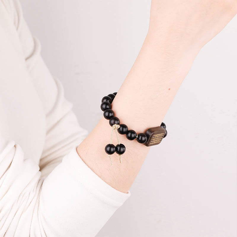Pulsera de Paz Grabada con Escrituras en Madera de Ébano de Piedras de Buda