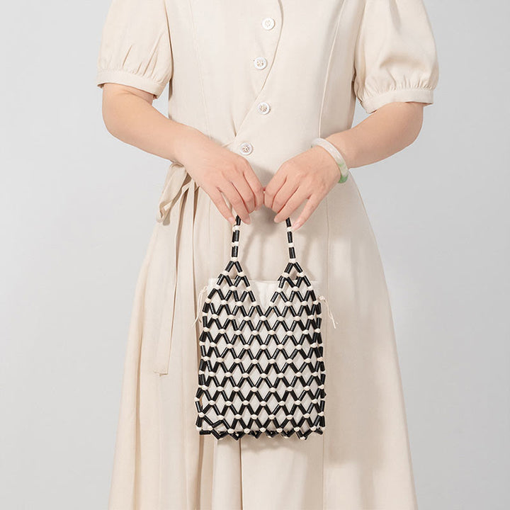 Bolsa de mano de cuentas de madera huecas tejidas a mano con piedras de Buda