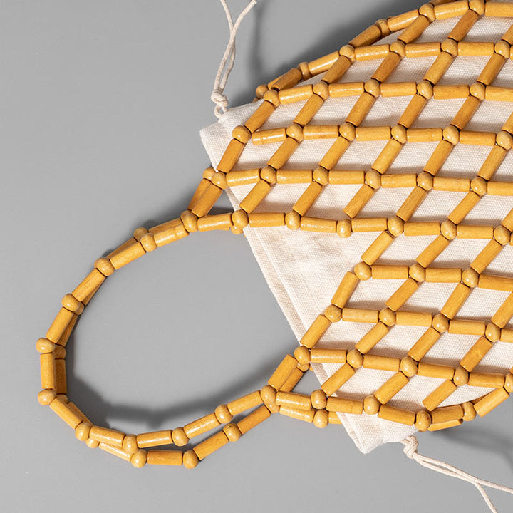 Bolsa de mano de cuentas de madera huecas tejidas a mano con piedras de Buda