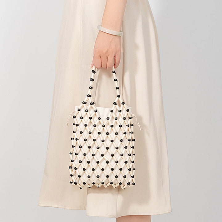 Bolsa de mano de cuentas de madera huecas tejidas a mano con piedras de Buda