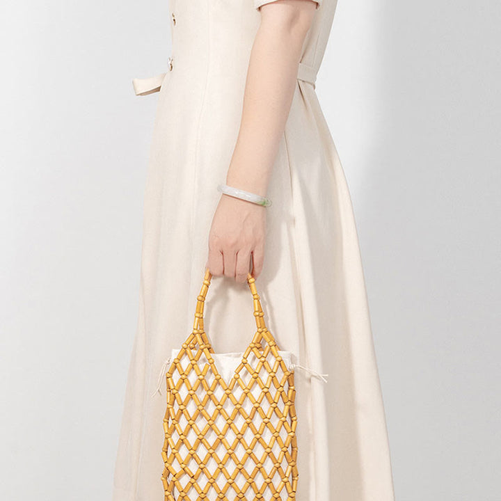 Bolsa de mano de cuentas de madera huecas tejidas a mano con piedras de Buda