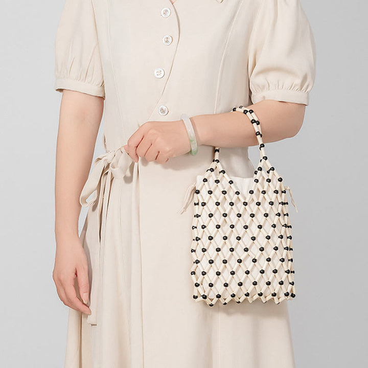 Bolsa de mano de cuentas de madera huecas tejidas a mano con piedras de Buda