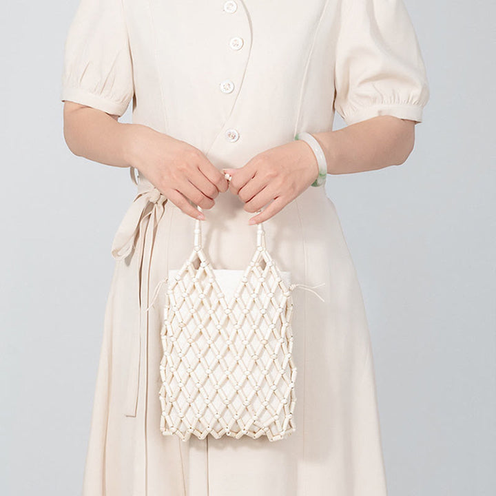 Bolsa de mano de cuentas de madera huecas tejidas a mano con piedras de Buda