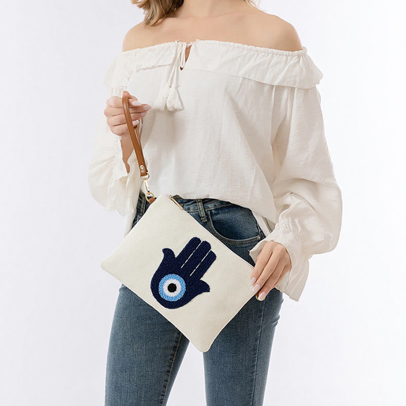 Bolso bandolera de lona de Hamsa con hojas del ojo malo y piedras de Buda