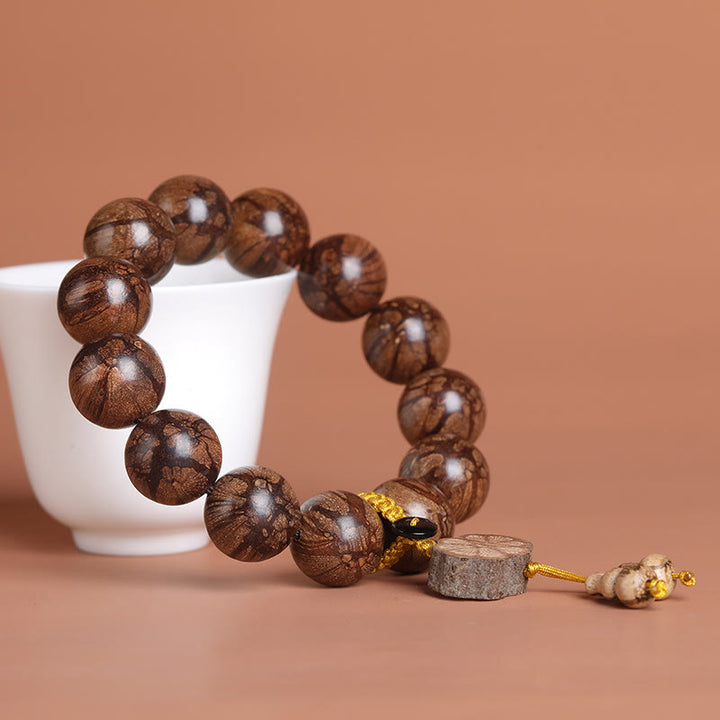 Pulsera de Madera de Flor de Ciruelo de Buddha Stones para la Paz Interior