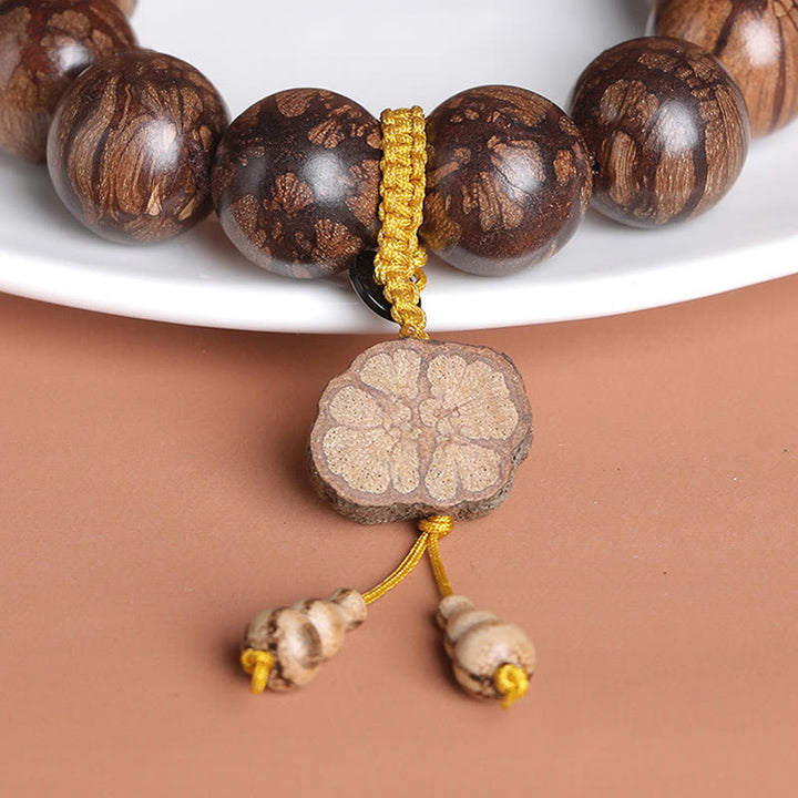 Pulsera de Madera de Flor de Ciruelo de Buddha Stones para la Paz Interior