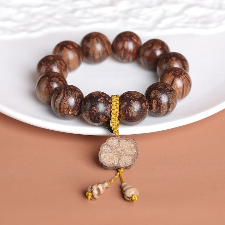 Pulsera de Madera de Flor de Ciruelo de Buddha Stones para la Paz Interior