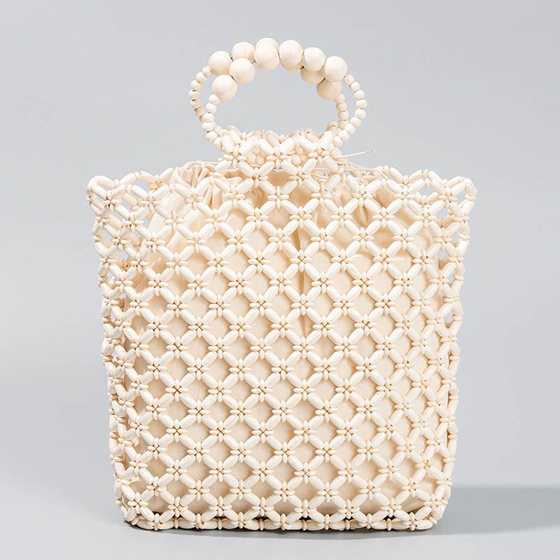 Bolso de cuentas de madera huecas tejidas a mano con hilo de pesca tejida y piedras de Buda