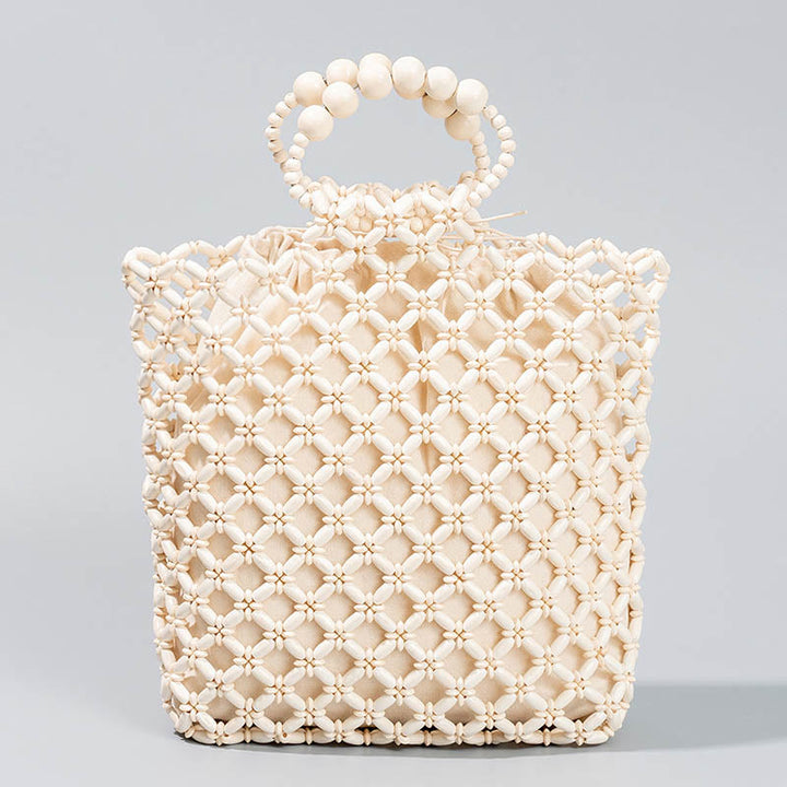 Bolso de cuentas de madera huecas tejidas a mano con hilo de pesca tejida y piedras de Buda