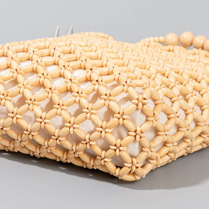 Bolso de cuentas de madera huecas tejidas a mano con hilo de pesca tejida y piedras de Buda