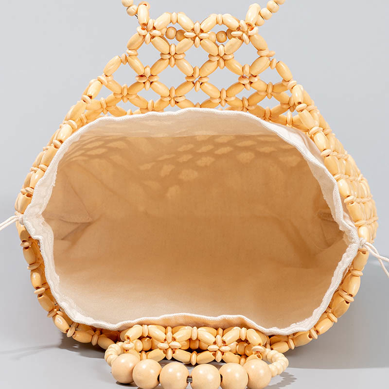 Bolso de cuentas de madera huecas tejidas a mano con hilo de pesca tejida y piedras de Buda