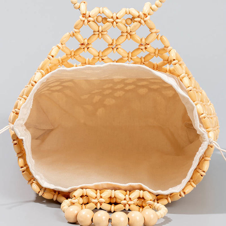 Bolso de cuentas de madera huecas tejidas a mano con hilo de pesca tejida y piedras de Buda