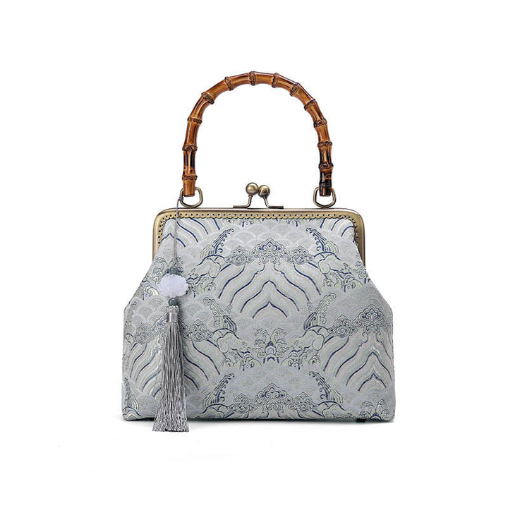 Bolso cruzado con cadena de metal, líneas plateadas y mango de bambú de Piedras Buddha