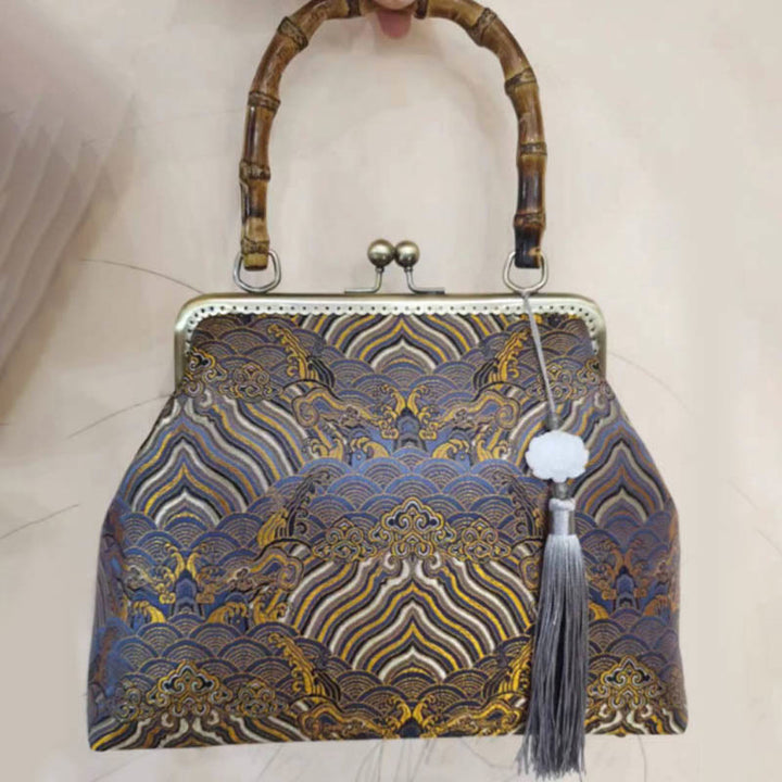 Bolso cruzado con cadena de metal, líneas plateadas y mango de bambú de Piedras Buddha