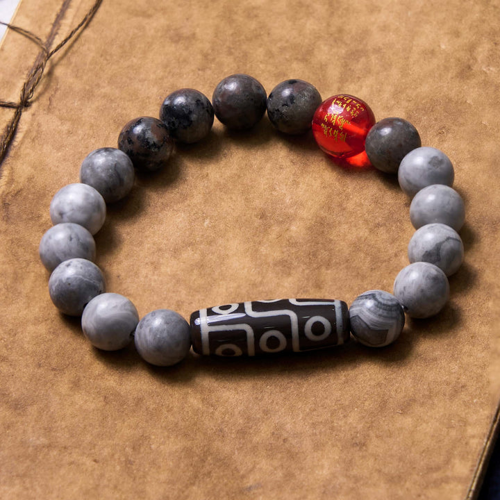 Pulsera positiva de jaspe Picasso con cuentas Dzi tibetanas de nueve ojos con Buddha Stones