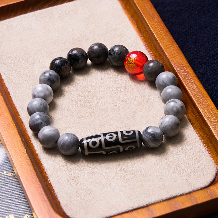 Pulsera positiva de jaspe Picasso con cuentas Dzi tibetanas de nueve ojos con Buddha Stones