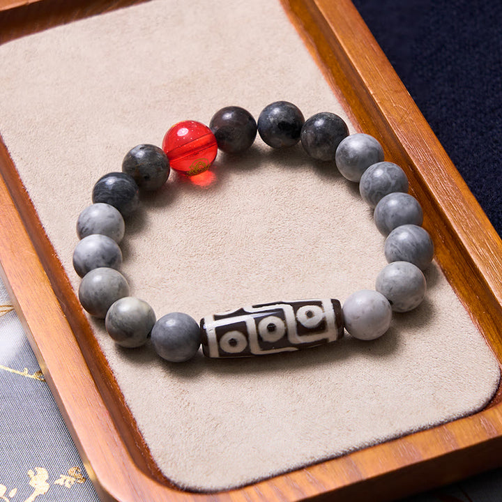 Pulsera positiva de jaspe Picasso con cuentas Dzi tibetanas de nueve ojos con Buddha Stones
