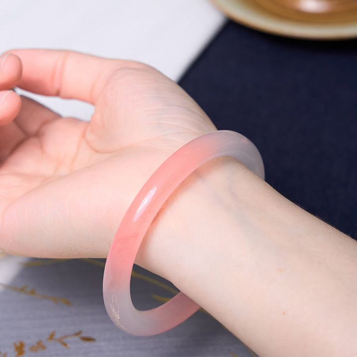 Buddha Stones Atraer amor y protección Pulsera rosa Paquete