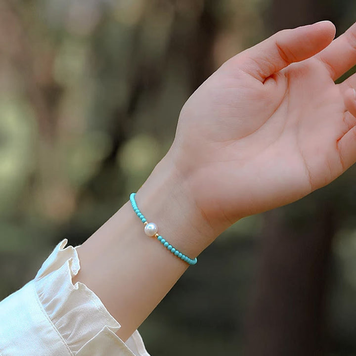 Pulsera de protección de pequeñas cuentas de piedras de Buda con turquesa, ágata roja y perla