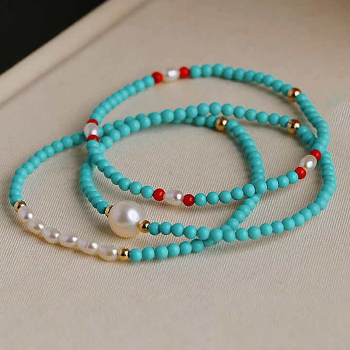 Pulsera de protección de pequeñas cuentas de piedras de Buda con turquesa, ágata roja y perla