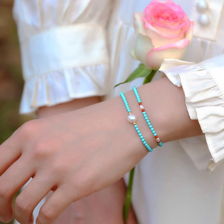 Pulsera de protección de pequeñas cuentas de piedras de Buda con turquesa, ágata roja y perla