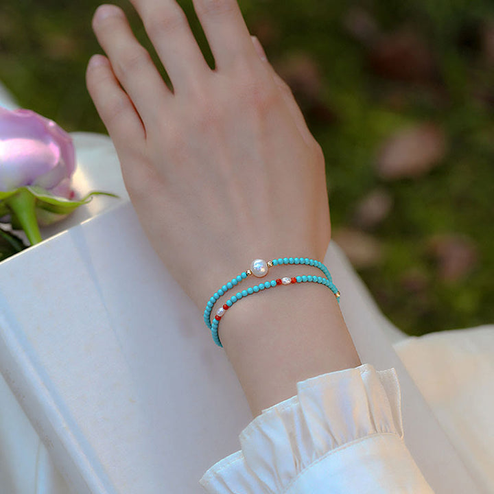 Pulsera de protección de pequeñas cuentas de piedras de Buda con turquesa, ágata roja y perla