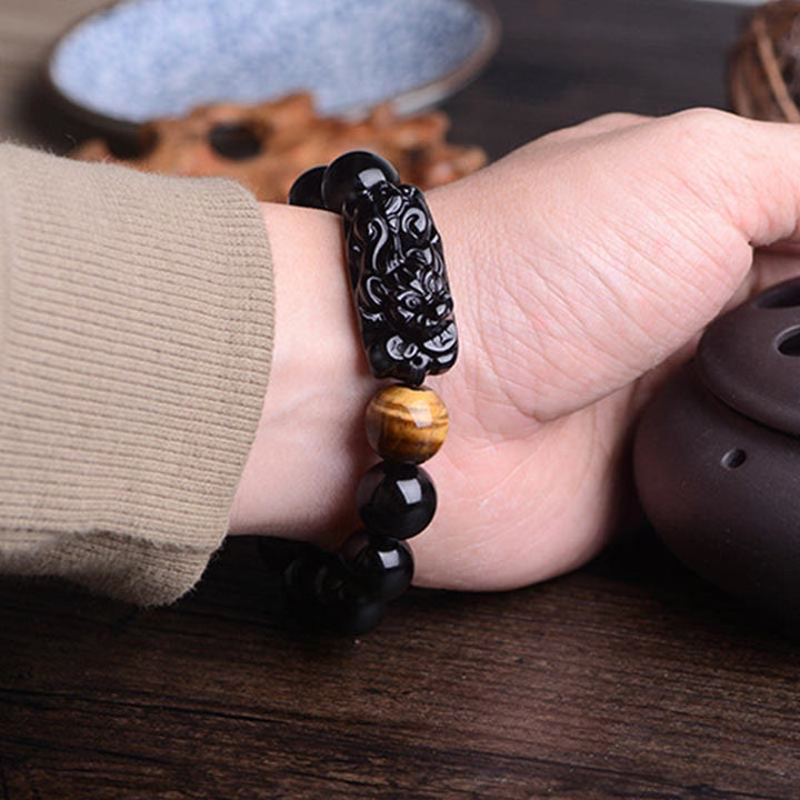 Pulsera de fuerza de ojo de tigre y PiXiu de obsidiana negra natural de Buddha Stones