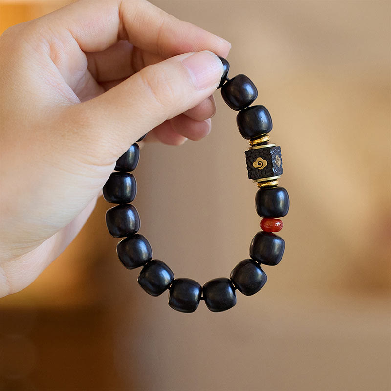 Pulsera de calma grabada en madera de ébano con nubes auspiciosas y Buddha Stones