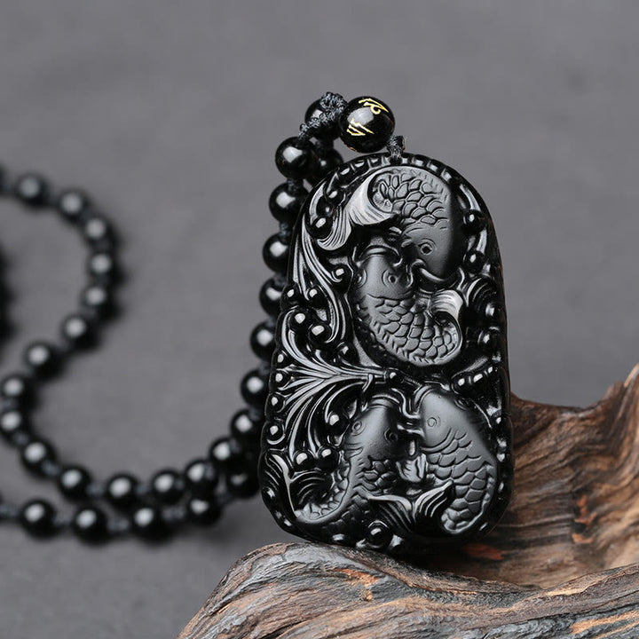 Colgante de collar con cuentas grabadas de fuerza con pez koi en obsidiana negra de Buddha Stones - image 9