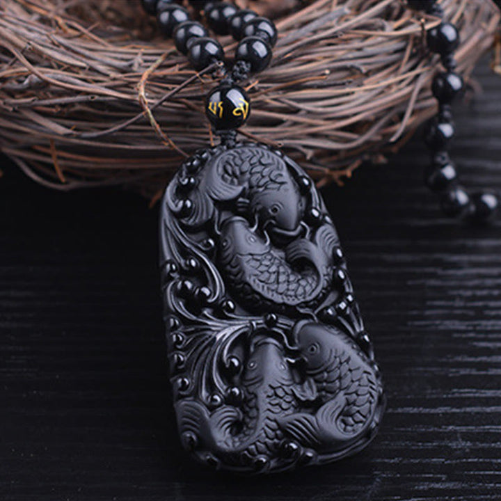 Colgante de collar con cuentas grabadas de fuerza con pez koi en obsidiana negra de Buddha Stones - image 12