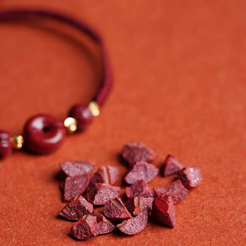 Buddha Stones Pulsera tejida a mano de cinabrio con hebilla de paz de loto, bendición y calma
