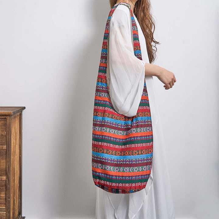 Bolso bandolera de algodón con patrón de rayas geométricas coloreadas Buddha Stones