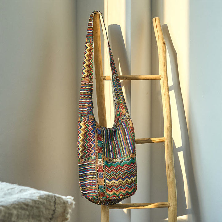 Bolso bandolera de algodón con patrón de olas verdes y marrones de Buddha Stones