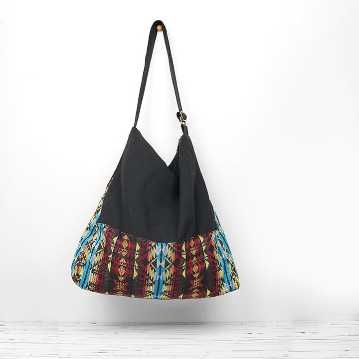 Bolso bandolera de algodón con patrón de rayas negras, rojas y azules de Buddha Stones