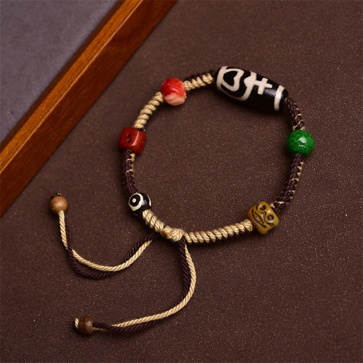 Pulsera de cuerda trenzada de riqueza con cuentas tibetanas Dzi hechas a mano de Buddha Stones