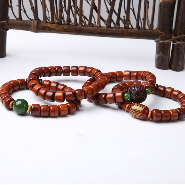 Pulsera de fuerza con Buddha Stones de hueso tibetano, cuentas Dzi de tres ojos, cuerno de oveja y ágata roja