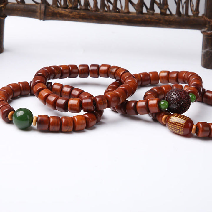 Pulsera de fuerza con Buddha Stones de hueso tibetano, cuentas Dzi de tres ojos, cuerno de oveja y ágata roja