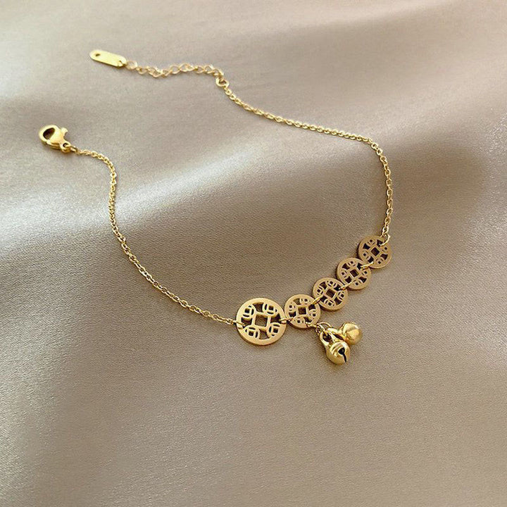 Buddha Stones Monedas de cobre Encanto de campana Tobillera reforzada de acero de titanio