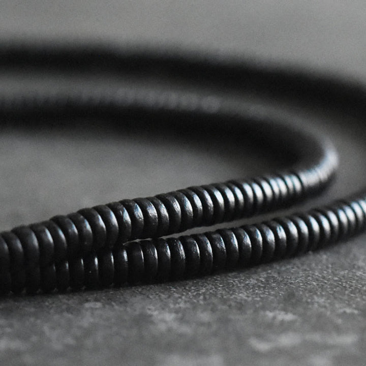 Pulsera multicapa de cuentas de madera de ébano tibetano de Buddha Stones y cobre de la paz