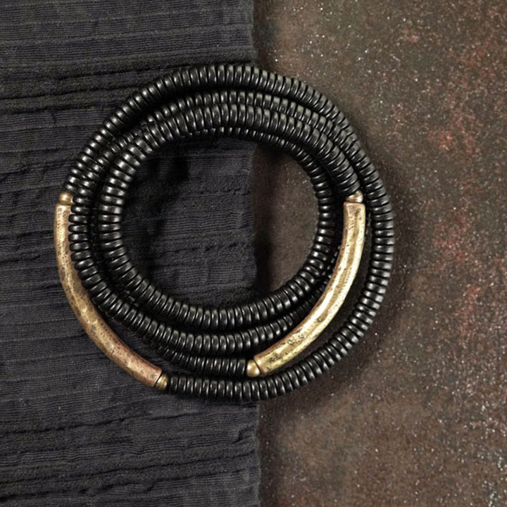 Pulsera multicapa de cuentas de madera de ébano tibetano de Buddha Stones y cobre de la paz