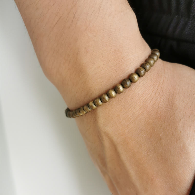 Pulsera sencilla de equilibrio de riqueza con cuentas de cobre y latón y Buddha Stones