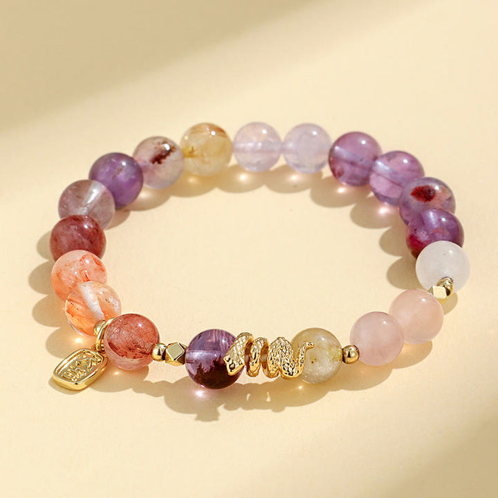 Pulsera de la suerte del año de la serpiente con Buddha Stones, varios cristales, cristal rosa y amatista