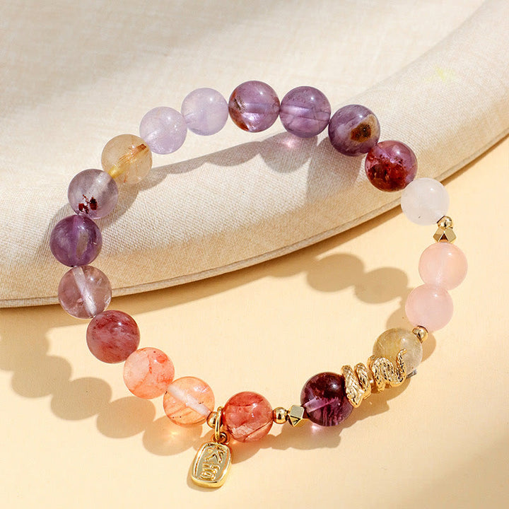 Pulsera de la suerte del año de la serpiente con Buddha Stones, varios cristales, cristal rosa y amatista