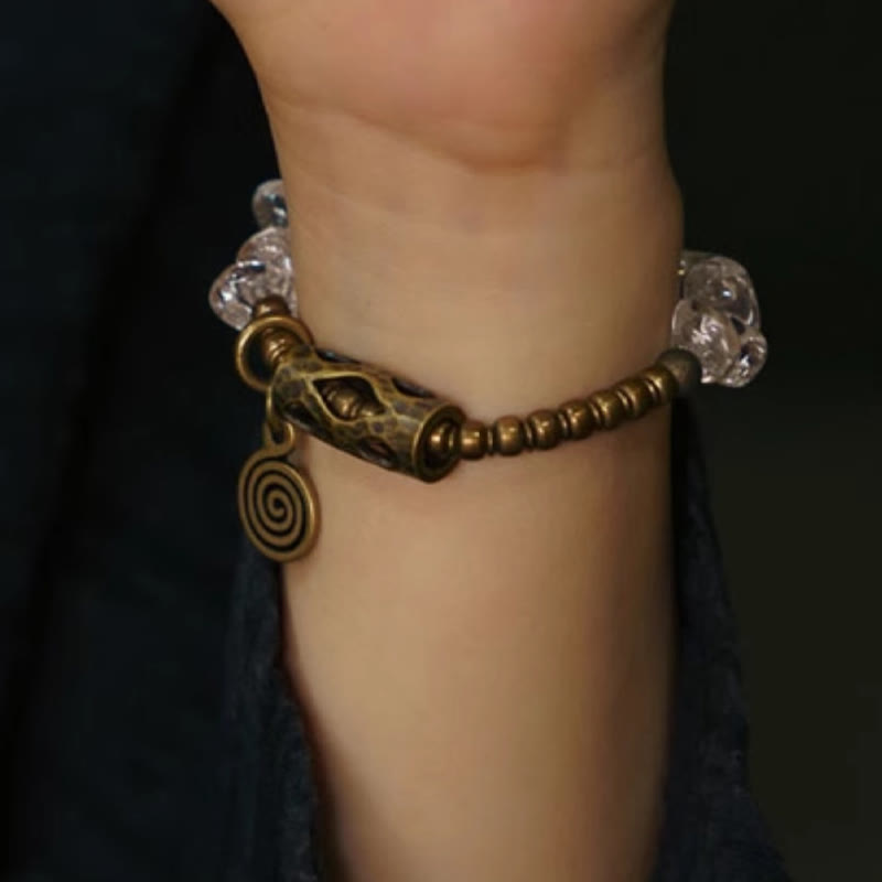 Pulsera de cobre con cristales blancos irregulares y Buddha Stones