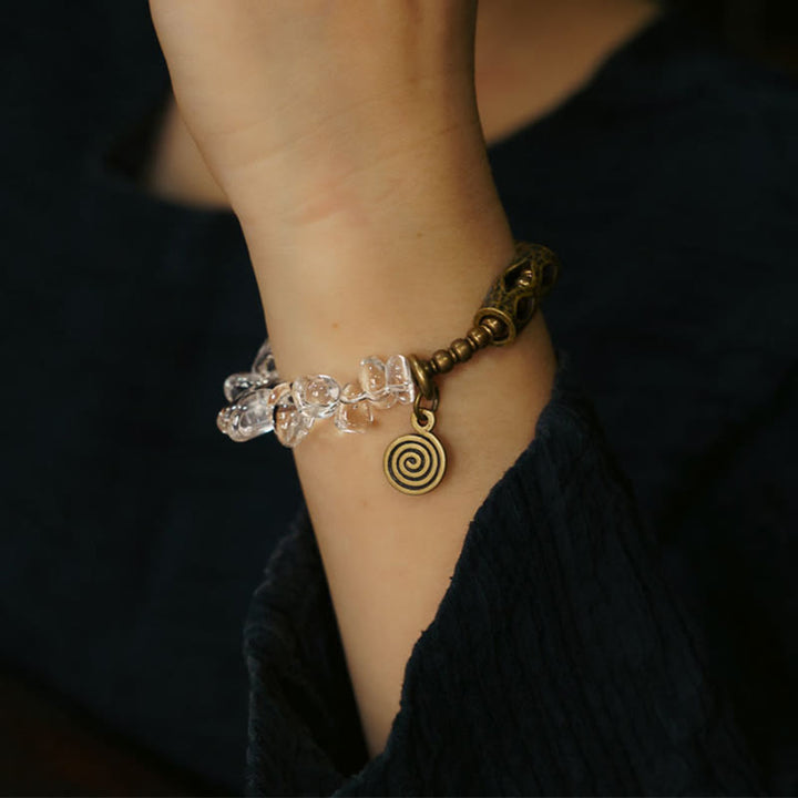 Pulsera de cobre con cristales blancos irregulares y Buddha Stones